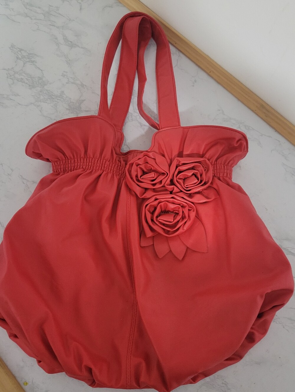 Cato Faux Leather Red Bubble Hobo Bag with Rose Embellishment.